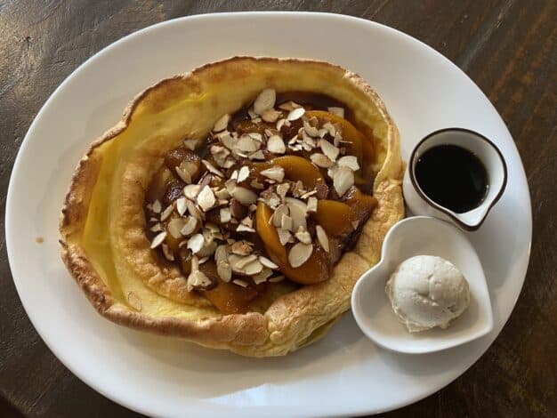 a breakfast dish called the Peach & Almond Dutch Baby